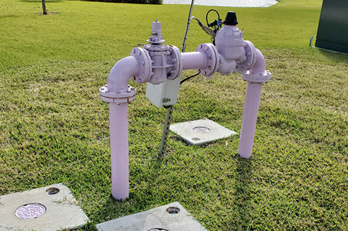 Backflow prevention device installed on exterior lawn